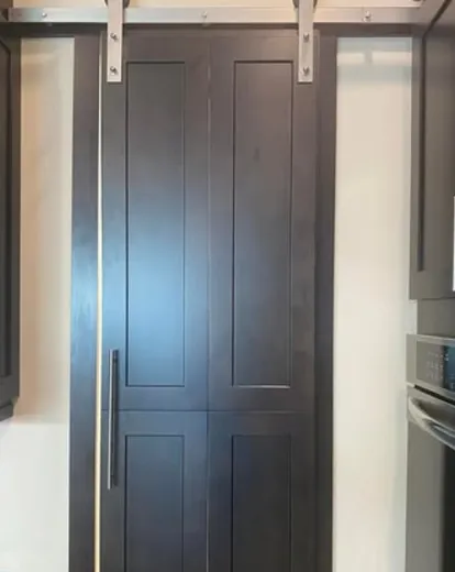 Custom cabinetry and integrated appliances in a finished Toronto kitchen