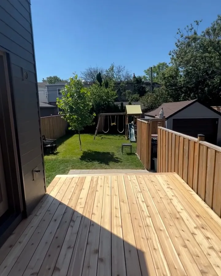 New custom wood deck running alongside a Toronto home