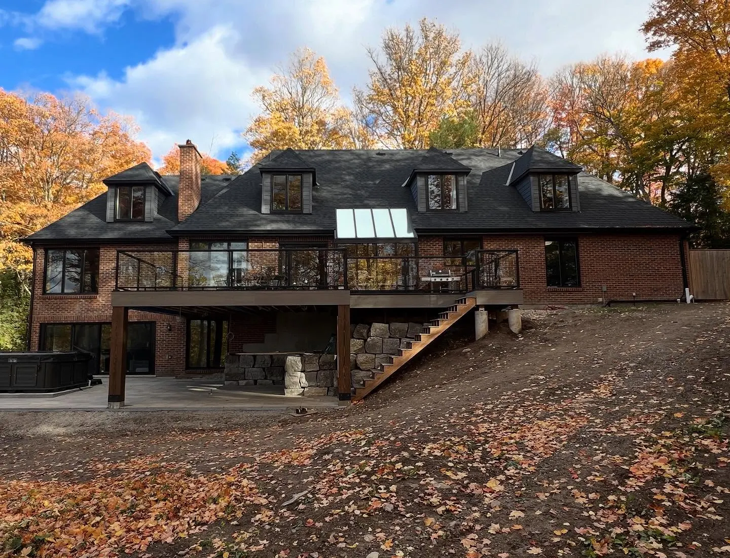 Large elevated deck completed behind a Toronto home in autumn